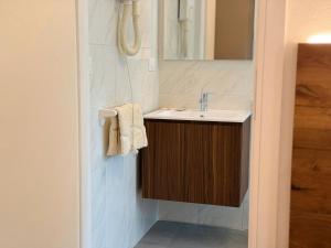 a bathroom with a sink and a mirror at Albergo Legazzuolo Montecampione in Artogne +75 photos