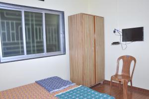 TV a/nebo společenská místnost v ubytování Hotel Anjali Lodge Malvan
