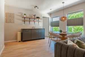 a living room with a couch and a table at Boven restaurant de Babbelaar 2 in Oostkapelle