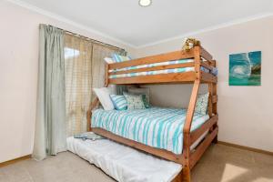 Ένα ή περισσότερα κρεβάτια σε δωμάτιο στο Rye Coastal Getaway