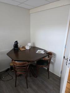 a table and chairs in a room with a table at Herberg de Griffioen in Wolphaartsdijk +21 photos
