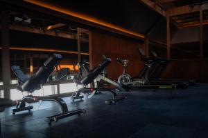a row of exercise bikes in a gym at Nuju Uluwatu - Adults Only in Uluwatu