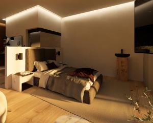 a bedroom with a large bed and a table at Cubea in Bodenmais