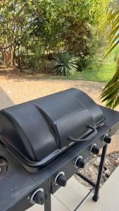a black grill sitting on top of a table at ZanziBlue Beach Hotel in Mfumbwi