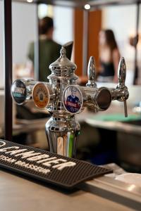 a drink dispenser sitting on top of a table at Babel Lille Centre in Lille