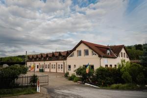 a large white building with a lot of windows at FELIX hostel in Dumbrăveni