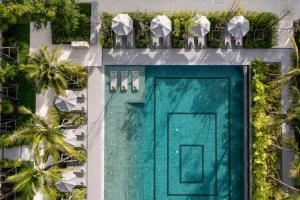 an overhead view of a building with a green door at Meliá Phuket Mai Khao in Mai Khao Beach +87 photos