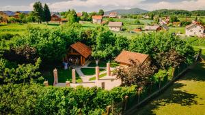 an aerial view of a vineyard with a house and trees at Lika Story in Josipdol +67 photos