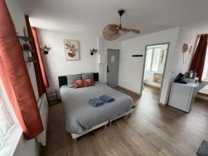 a bedroom with a bed with two pillows on it at ecuires 1 in Écuires