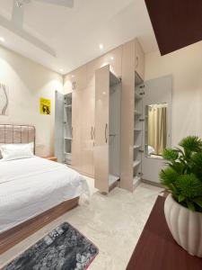 a bedroom with a large bed and a shower at CRAZZY HOME stay in Chandigarh Airport