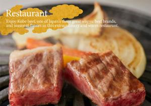 a piece of meat on a plate with bread at KAMENOI HOTEL Arima in Kobe