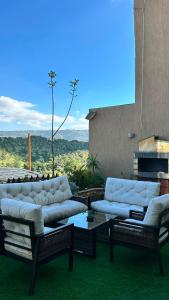 a living room with two couches and a table at Pilar Resort in Bayyūḑah