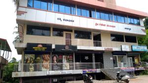 a building with a store in front of it at Shree Ganesh lodging in Bārkūr