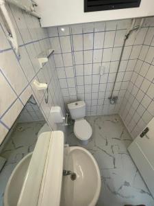 a bathroom with a sink and a toilet at Alevok Hotel in Erdek +24 photos