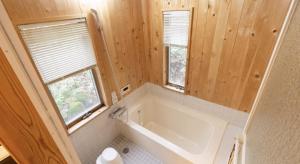 a small bathroom with a tub and a window at Daruma in Nasu +34 photos