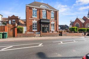 a brick building on the side of a street at The Churchill Hotel in Coventry