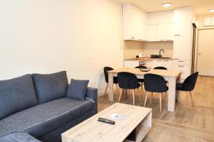 a living room with a couch and a table at SKYHILL 1 O1 Jahorna in Jahorina