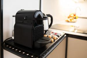 a coffee pot sitting on top of a stove at Aparthotel František in Světlá nad Sázavou