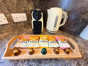 a tray with eggs and a coffee maker and a blender at The Galleries No 2 in Spean Bridge +17 photos