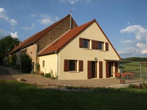 a white house with a brown roof at Le Clos in Anthien