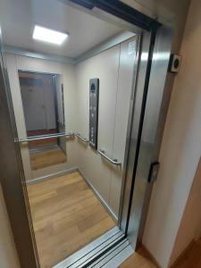 a elevator in a room with a mirror at Alte Mühle in Holzminden