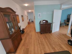 an empty living room with a wooden floor at Alte Mühle in Holzminden +1 photo