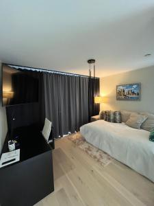 a bedroom with a large bed and a couch at Kvissentali House in Tartu