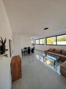 a living room with a couch and a table at Azur Apartments Bar in Bar