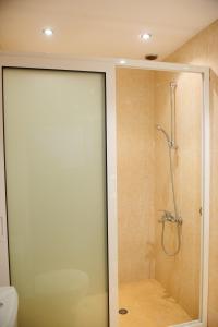 a shower with a glass door in a bathroom at Grancharova Guest House in Bansko +89 photos