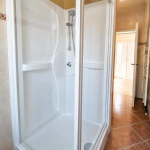a shower with a glass door in a bathroom at Les Mésanges Bleu in Malmedy +14 photos