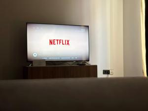 a television screen with the words netflix on it at Brussels Loft in Brussels