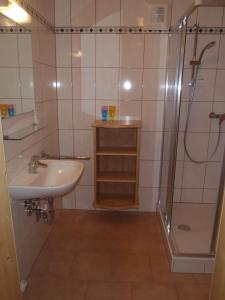 a bathroom with a sink and a shower at Russbachbauer in St. Wolfgang