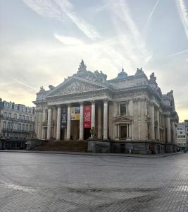 a large white building in a city at Brussels Loft in Brussels