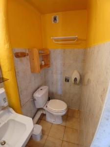 a bathroom with a white toilet and a sink at Auberge du Belvédère in Séez +19 photos