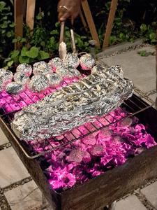 a table filled with silver and purple crystals at Garden Rooms by Shams Thoddoo in Thoddoo