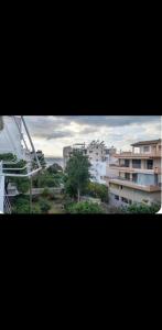 a view of a city with buildings and trees at Voula Asklipeio Residence Supreme in Athens