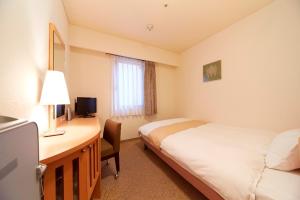 Voodi või voodid majutusasutuse Nest Hotel Kumamoto toas