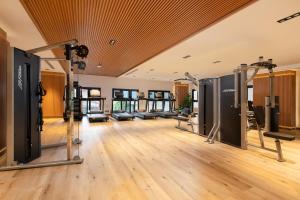 a gym with treadmills and cardio equipment at Anik Palace Hotel in Phnom Penh +65 photos