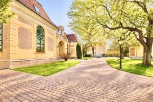 a brick driveway in front of a house at Castle Park Suites in Hermina-major