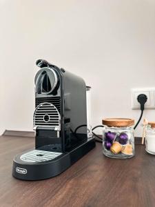 a toaster sitting on a table with a jar of food at LUMEA Devin in Stralsund