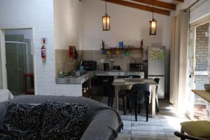 a kitchen with a table and a counter top at Numbi Hills Self-Catering in Hazyview