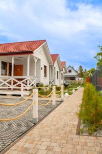 a house with a yellow rope around it at Wakacje Bobolin in Bobolin