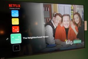 a television screen with a picture of two people at The Neighborhood Haven in Richards Bay