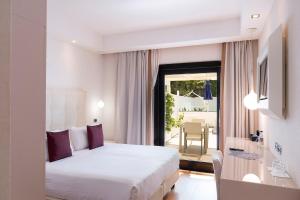 a hotel room with a bed and a balcony at Relais Paradiso in Vietri sul Mare +54 photos