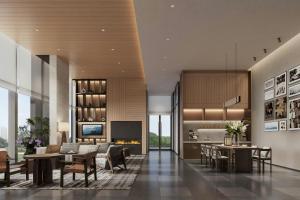 a lobby with tables and chairs and a kitchen at Fairfield by Marriott Kunming Xishan in Kunming