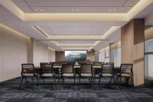 a conference room with a long table and chairs at Fairfield by Marriott Kunming Xishan in Kunming