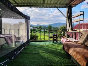a view from a room with a view of the mountains at Garden de Arts in Pai