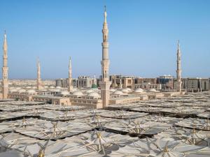 a view of a mosque with domes and minarets at Anwar Al Madinah Mövenpick in Medina
