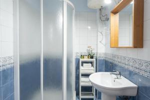 a bathroom with a sink and a shower at Vv Casa Marire in Breña Alta
