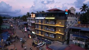 an overhead view of a city with a building at Kamath Yatri Nivas Plus in Māvalli
